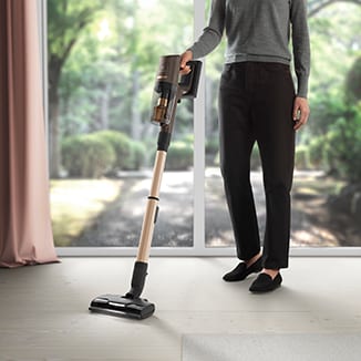 Man vacuuming carpet